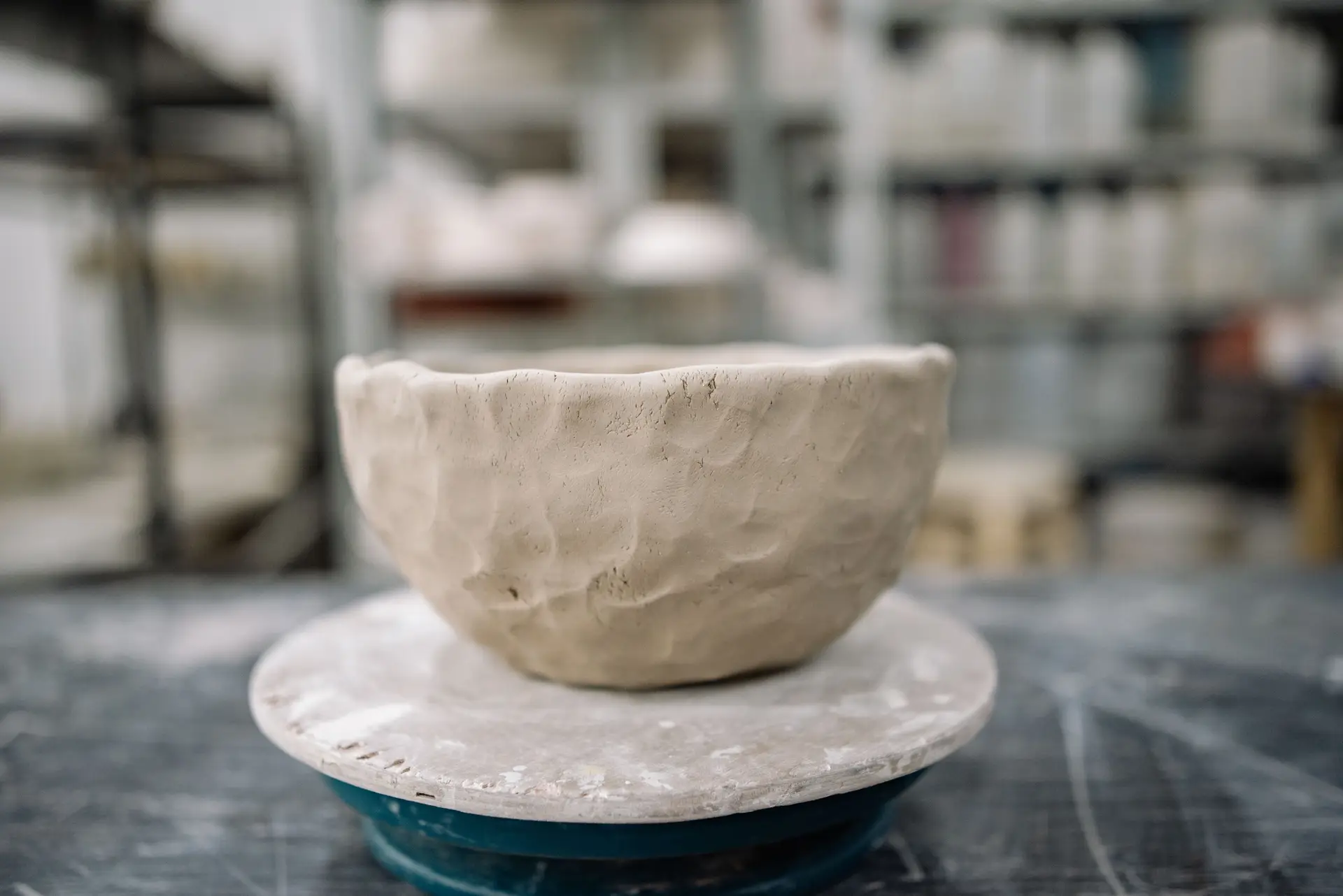 Clay bowl on wheel